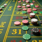 Body-A-roulette-table-with-stacks-of-casino-chips-on-betting-option-Roulette-odds